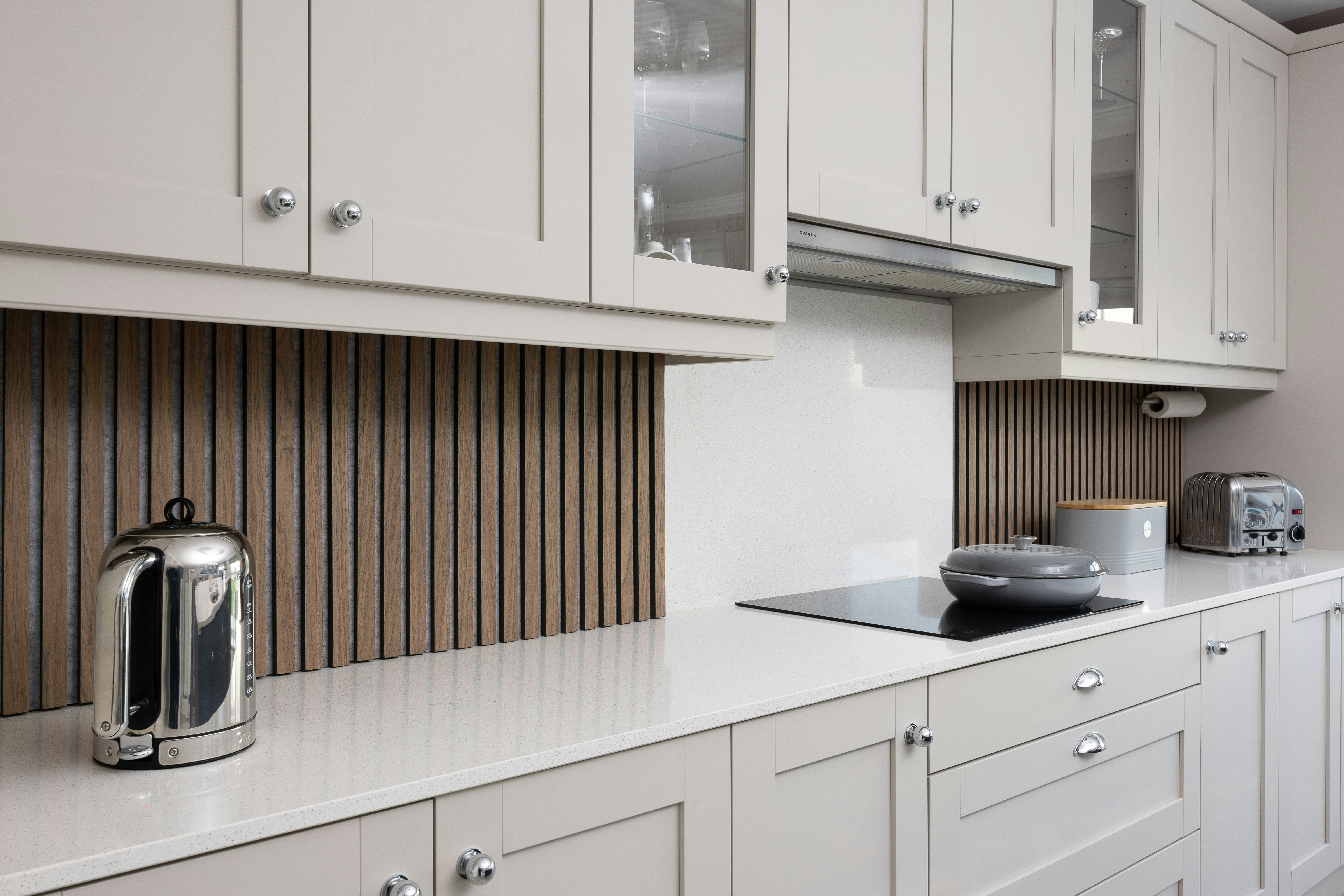An elegant shaker-style kitchen with premium appliances