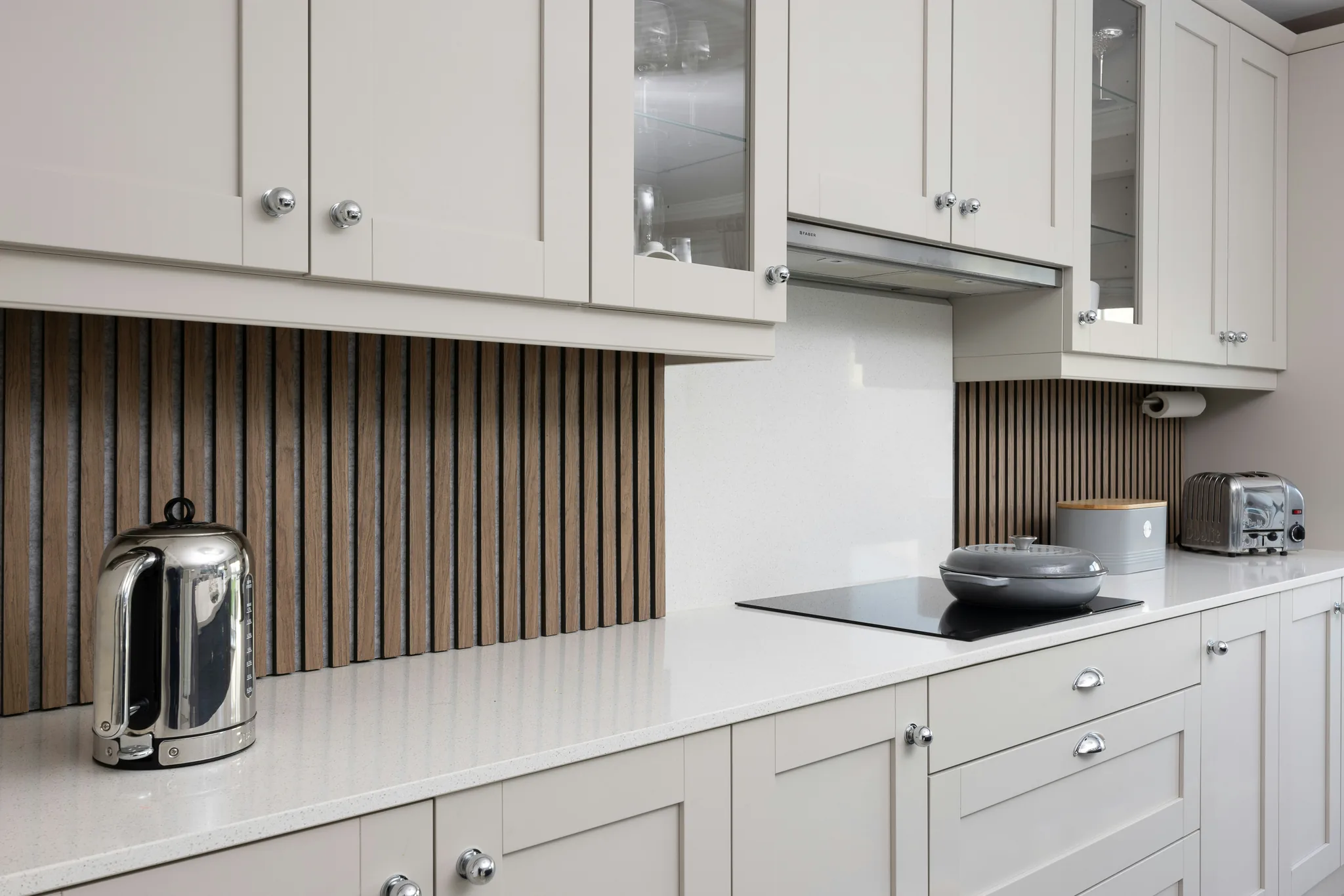 An elegant shaker-style kitchen with premium appliances